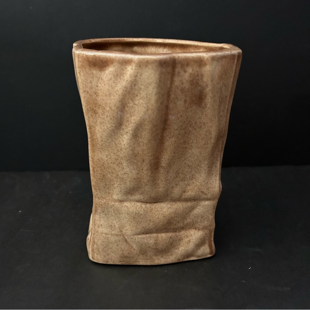 glazed ceramic pottery in paper bag shape